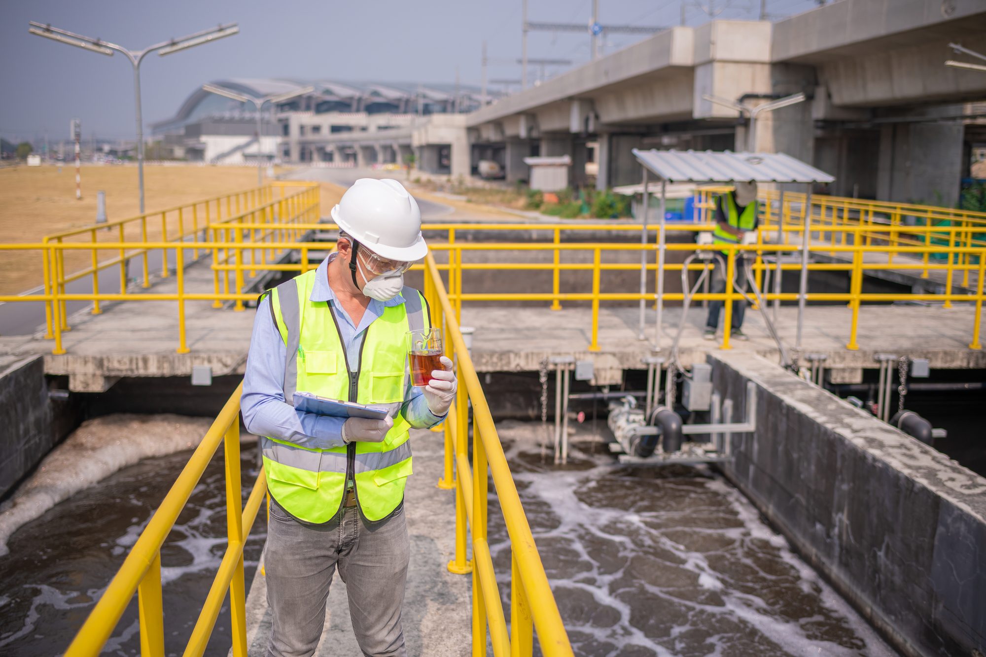 Engineer Took A Sample Water From a Wastewater Treatment Pond